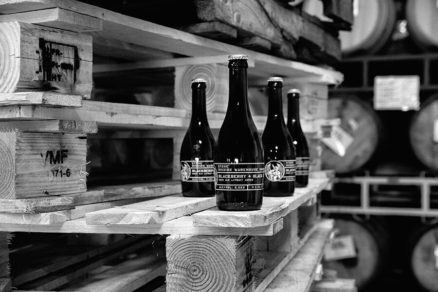 Stone Mission Warehouse Sour - Blackberry & Black Currant Bottles in warehouse