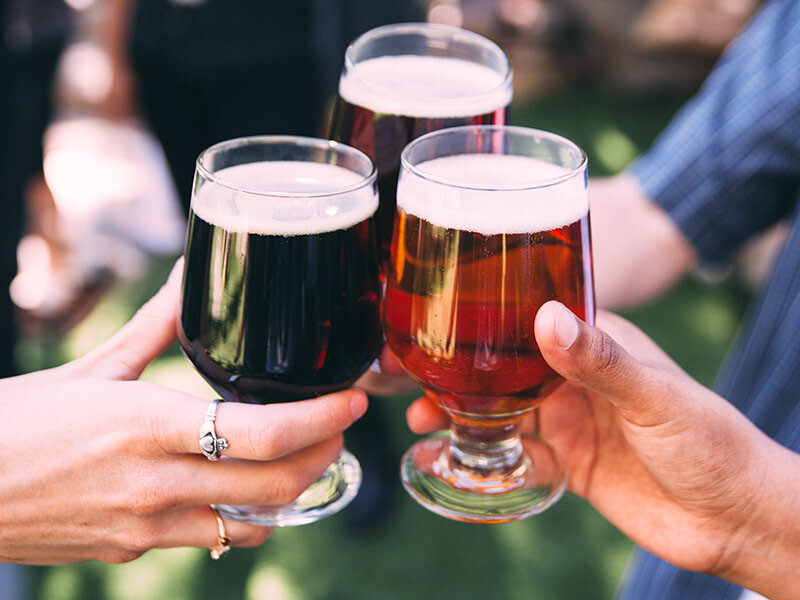 three different beers in glasses