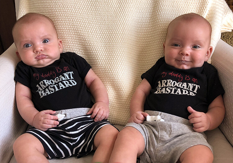 Babies in arrogant bastard onesies